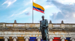 Colombia Flag with Statue - Market Entry Practical Guide